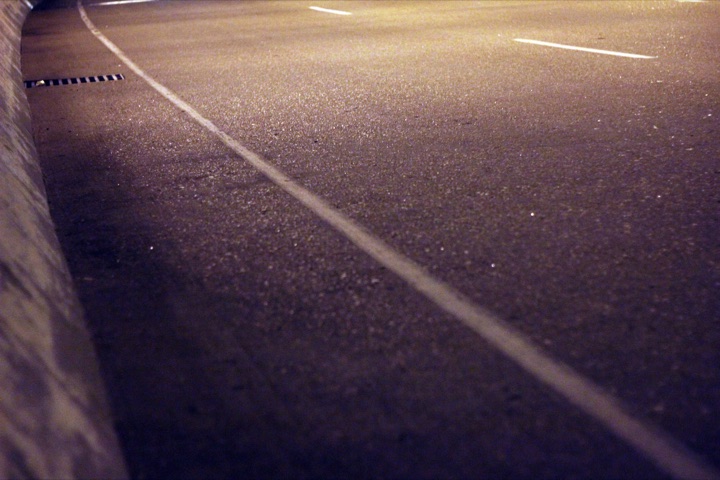 Follow the lines on the road.