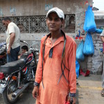 a motorcycle mechanic in sialkot, pakistan